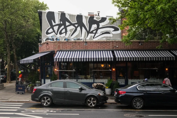 A one-story brick building houses the restaurant Sailor on a corner in Fort Greene