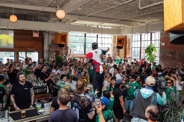 a crowd gathered at the new futbol-centric cantina, socceria